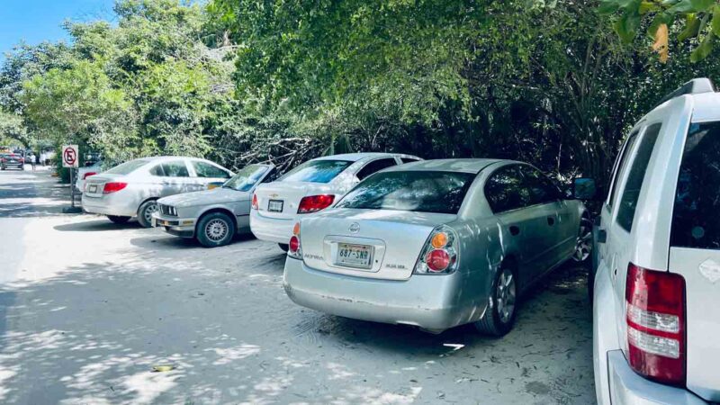 Rental cars parking on the road in Mexico by beach