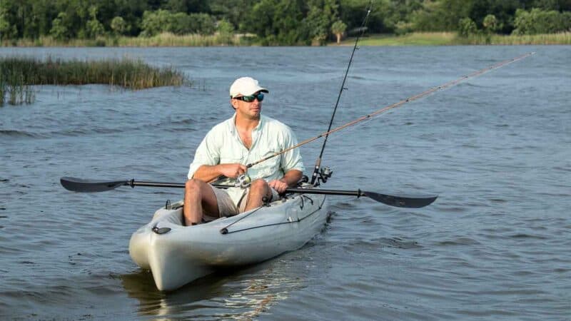 man fishing in kayak 