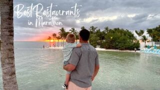 Father & son watching the sunset over the ocean at a restaurant on the water in Marathon Florida