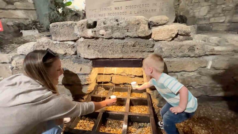 Family drinking the water from the fountain of youth