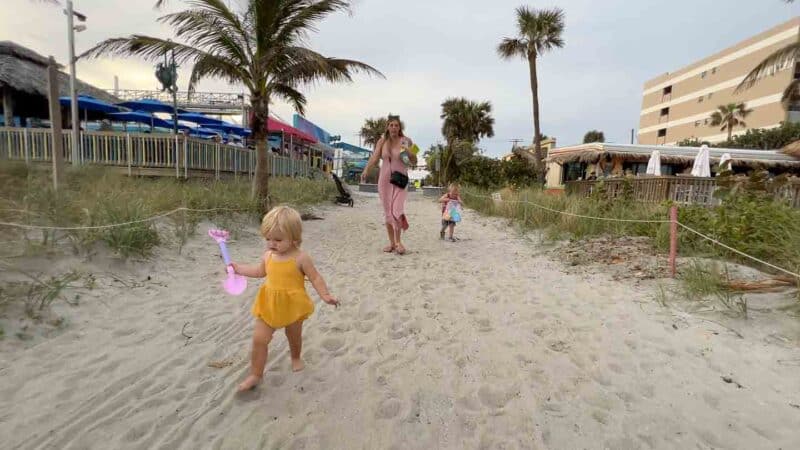 Childen walking on the beach in Cocoa Beach Florida