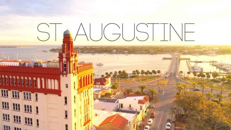 Drone photo showing part of the St. Augustine Skyline and Lion's gate bridge at sunrise