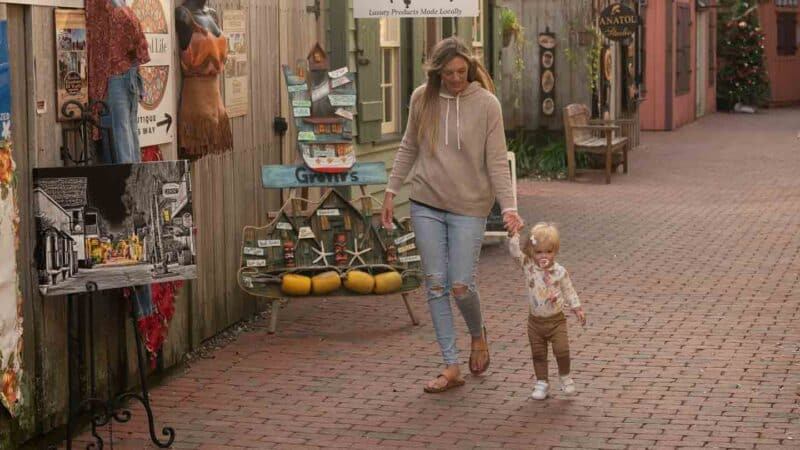 Woman and daughter walking on St George Street in St. Augustine Florida