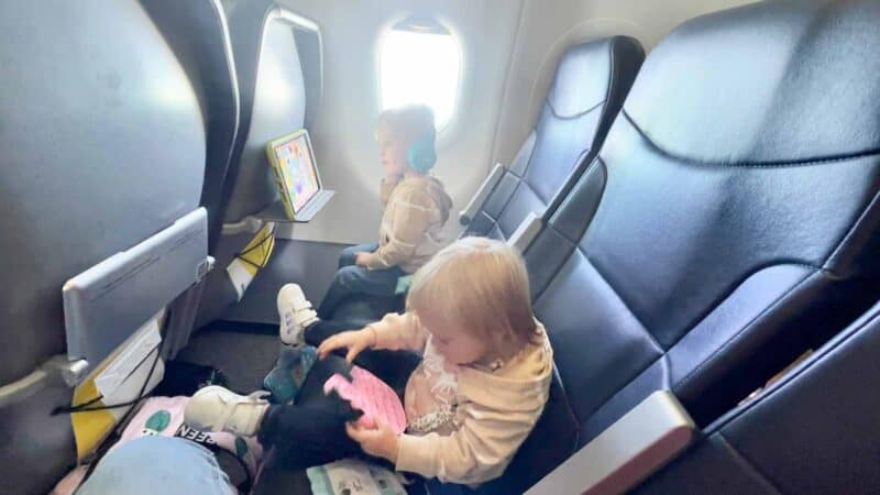 toddlers flying with toys