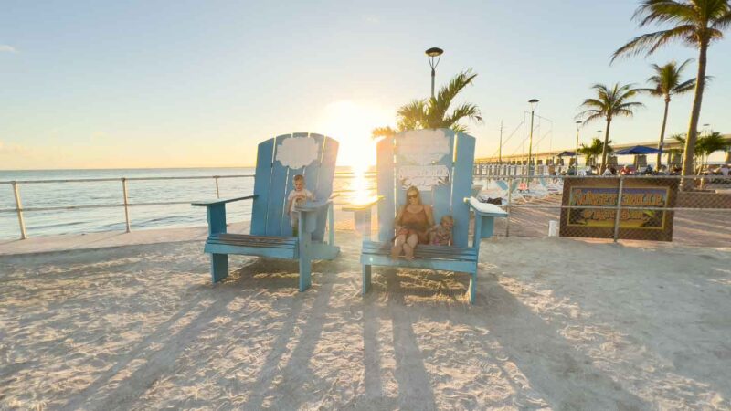 Mom and two kids in big beach chairs at Sunset Grille in Marathon