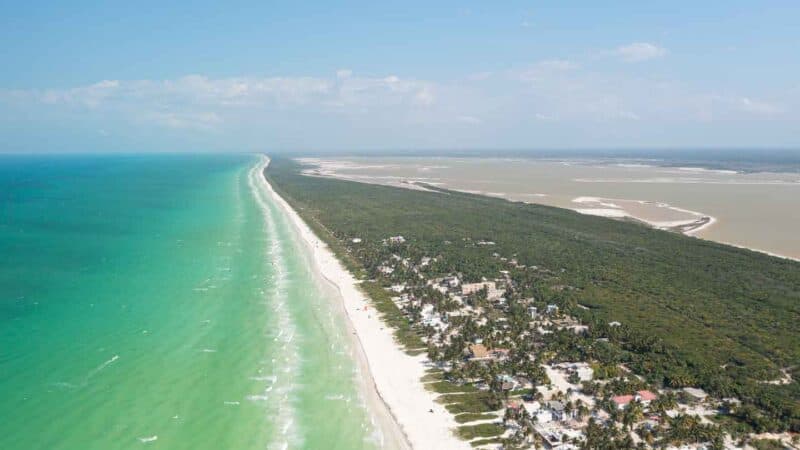 Aerial drone photo of the beach and city of El Cuyo Mexico