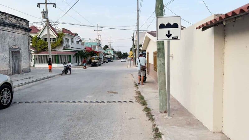 Center of El Cuyo road with no traffic and speed bumps