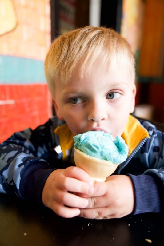 toddler eating Blue Moon ice cream at the House of Flavors restaurant in Ludington