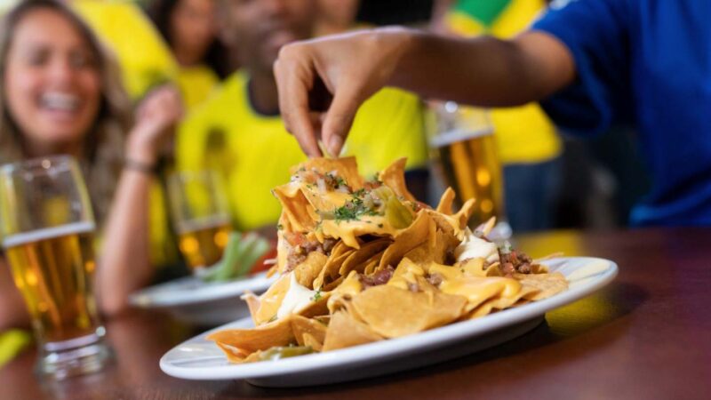 plate of nachos and beer at a bar restaurant