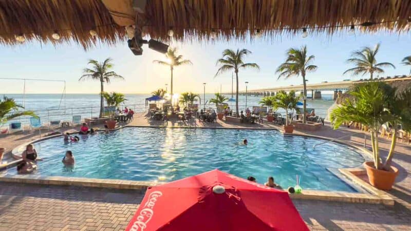 View of the pool and outdoor bar overlooking the seven mile bridge at Sunset Grille in Marathon FL