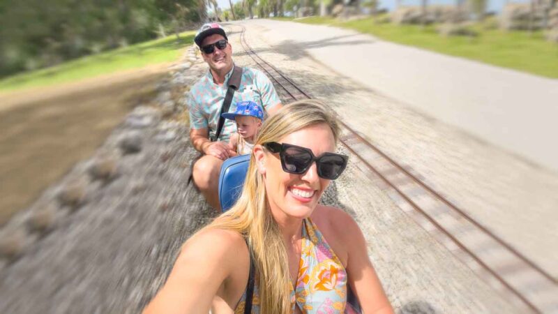 Family riding the mini train at Lakes Park near Fort Myers FL - Top attractions with Kids