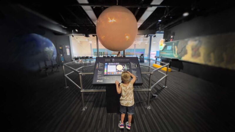 Young boy interacting with the exhibits at the IMAG History and Science Museum in fort Myers FL
