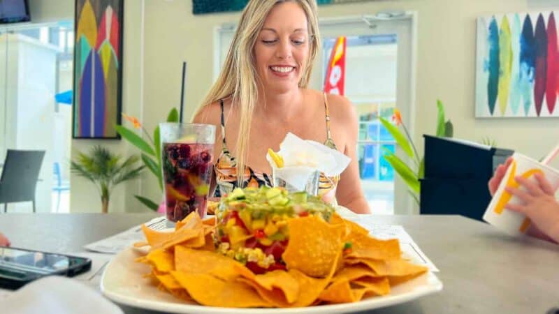 Woman eating at a restaurant in Fort Myer FL with her family