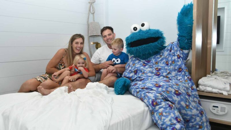 Family with Cookie Monster in bed at Beaches Negril Resort 