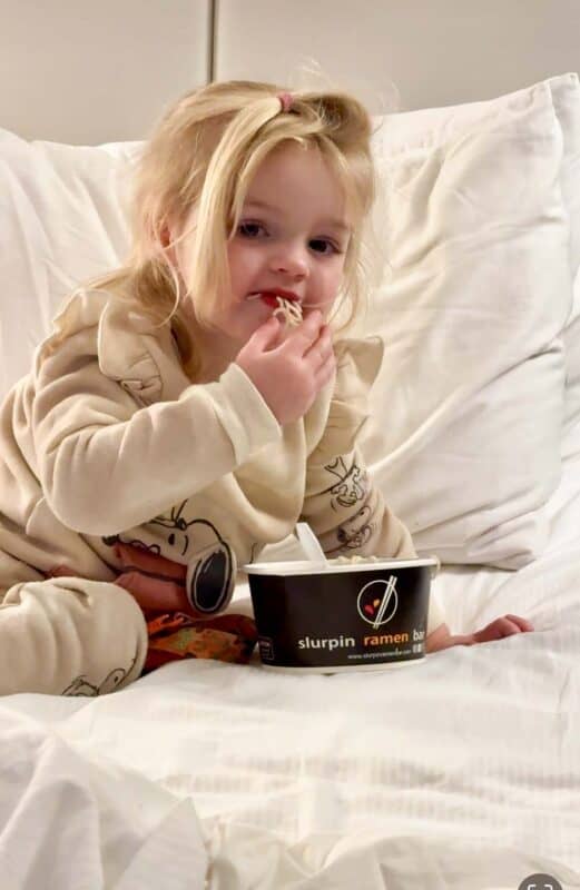 toddler eating Slurpin' Ramen Bar Noodles in Bed