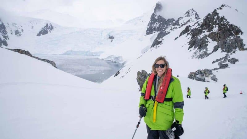 Woman hiking in Antarctica on a warm day