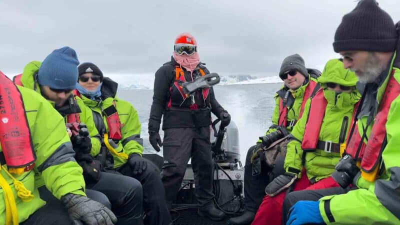 boat full of passengers on a scenic Zodiac cruise in Antarctica