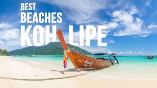colorful long tail traditional boat anchored on the sand on the Best beaches in Koh Lipe - Featured Image with white text