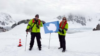 couple touching down in their 7th continent Antarctica