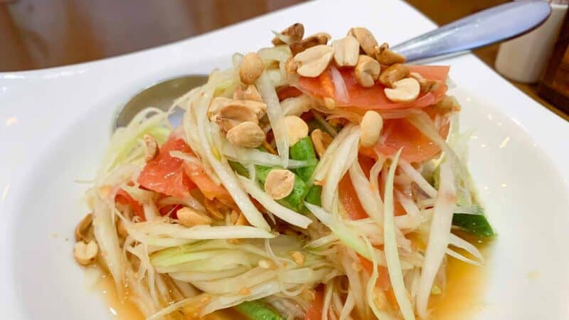 Traditional Thai Som Tam Papaya Salad on a plate in Thailand