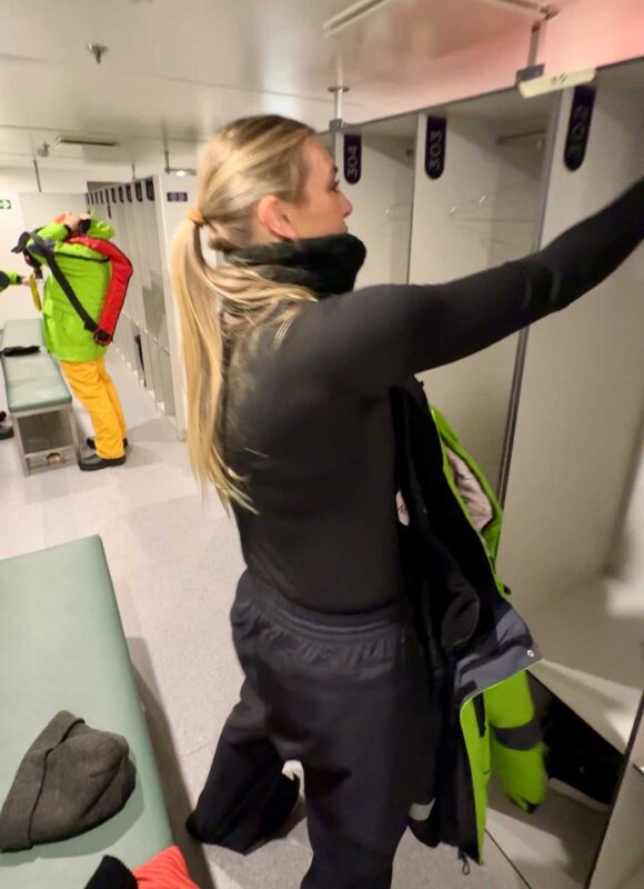women in mudroom getting ready for a landing in Antarctica with Atlas Ocean Voyages