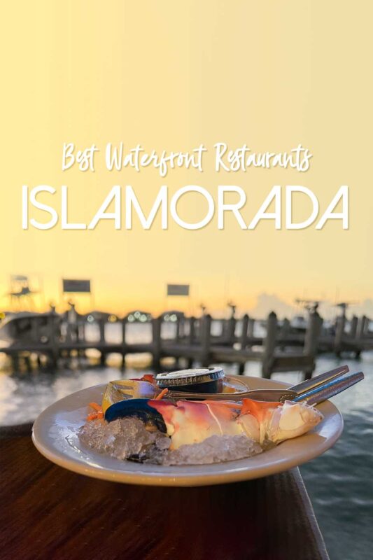 Pinterest pin of a snow crab claw at one of the best waterfront restaurants in Islamorada Florida Keys at sunset